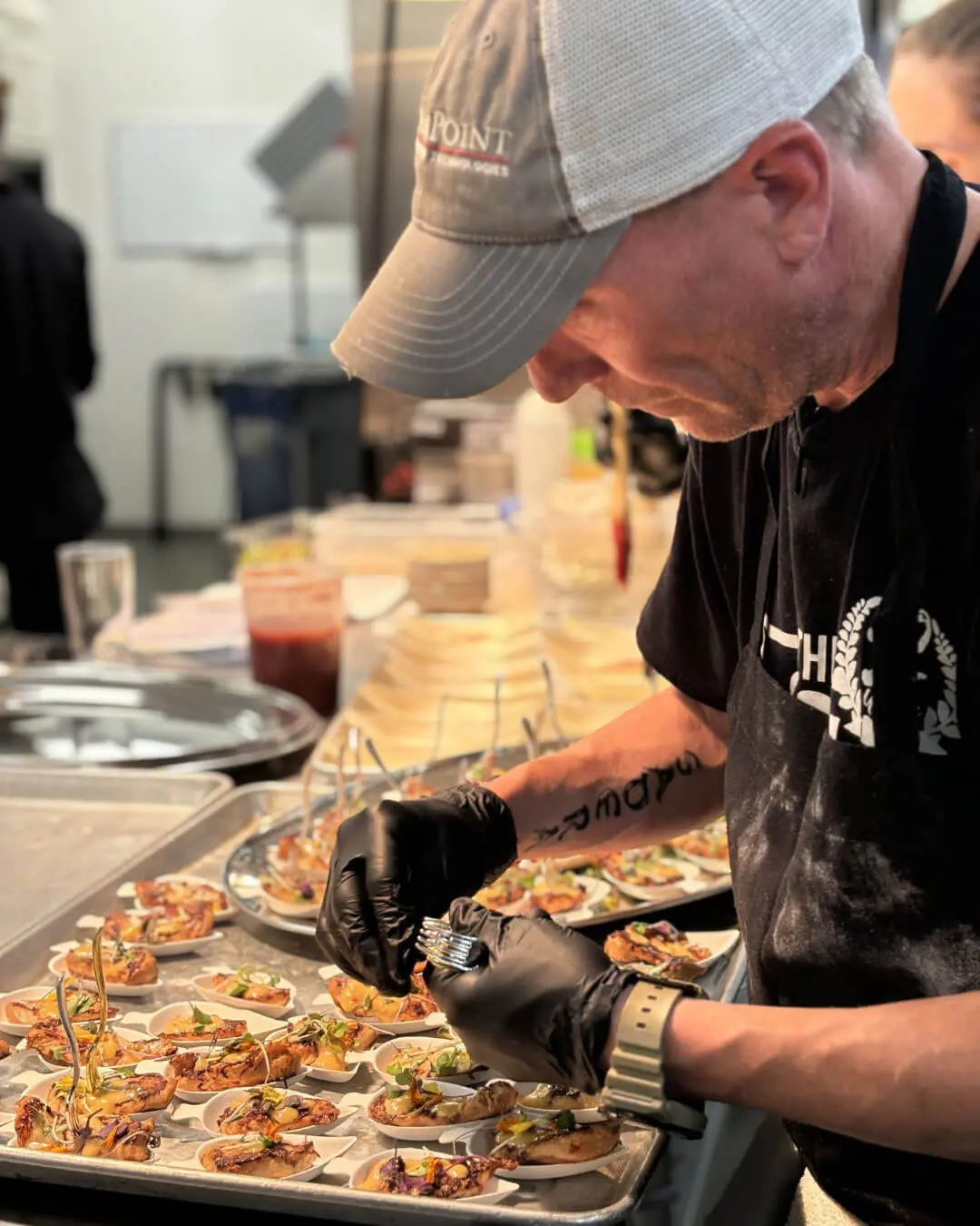 Chef plating appetizers catering