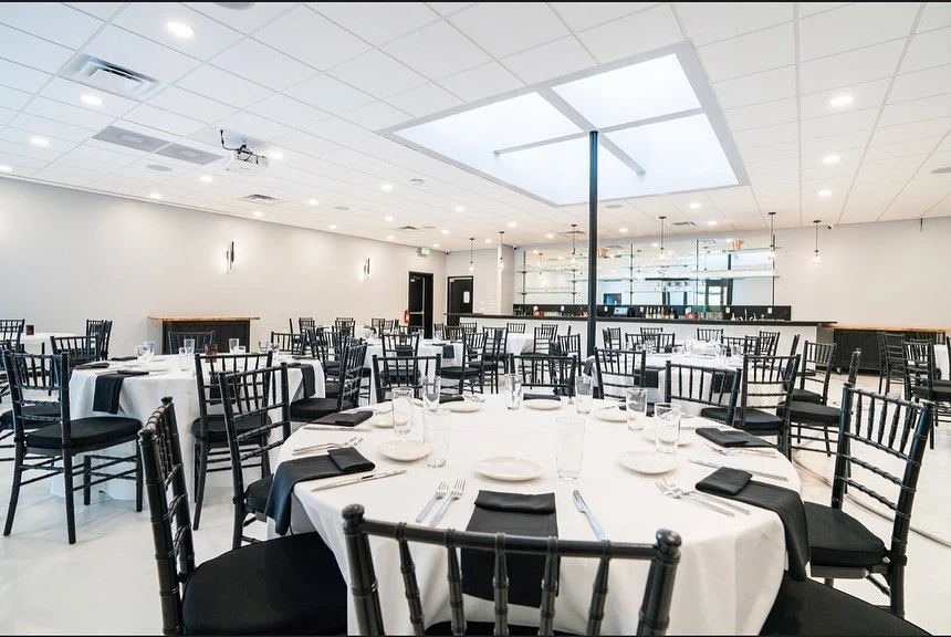 A decorated event venue in Fallston, MD set up for a celebration with tables and lighting.