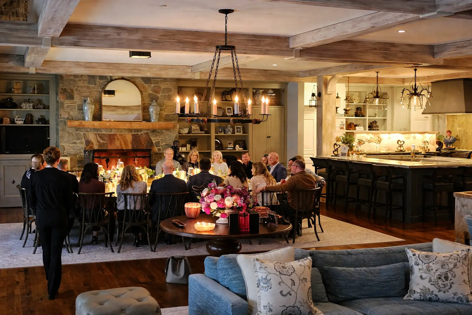 Guests gathered around a long dining table enjoying a cozy family style catering experience in a Baltimore, MD home