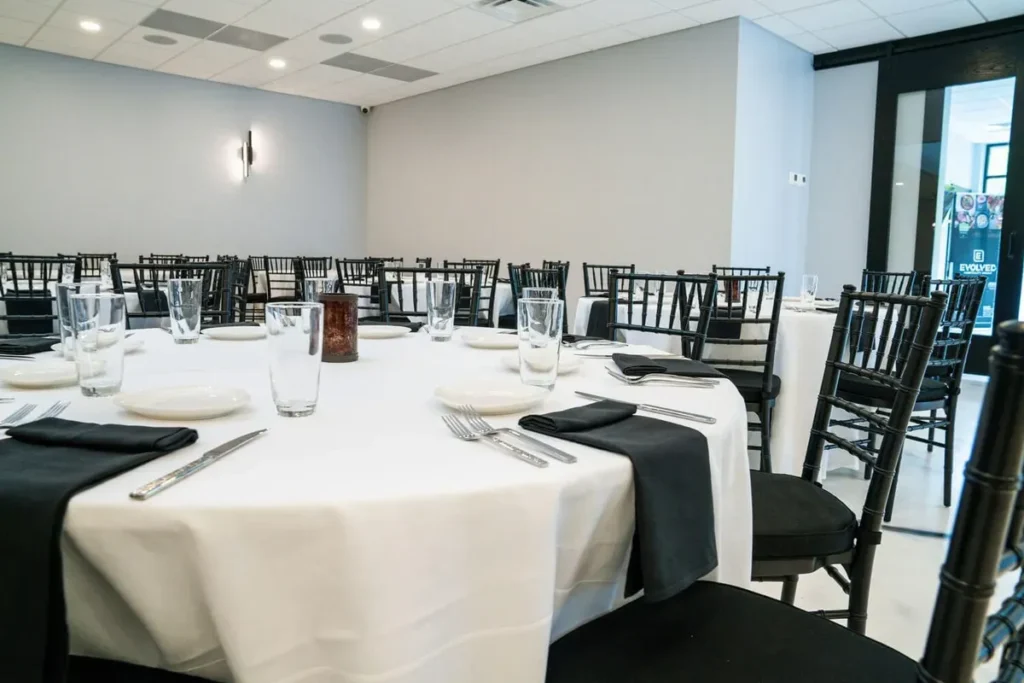 Round tables set for a catered event at a Baltimore catering company venue