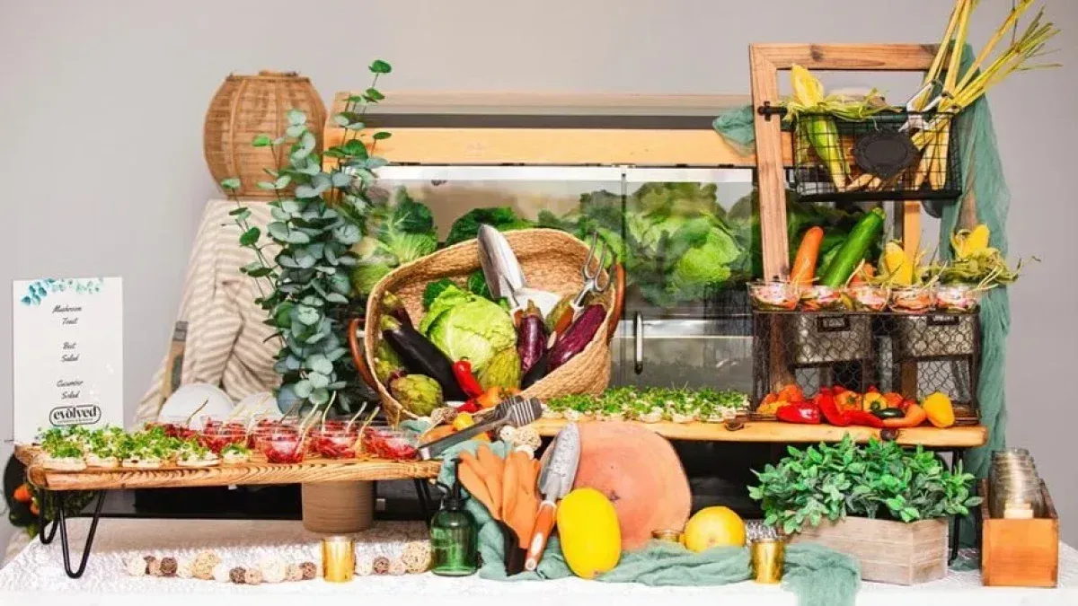 Farm to table station of fresh vegetables and produce baskets. Catering in Druid Hill Park, Baltimore.