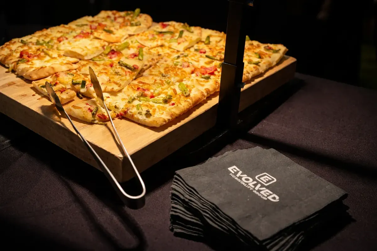 Flatbread cut into squares on a raised serving board. Catering in Loyola University Maryland, Baltimore.
