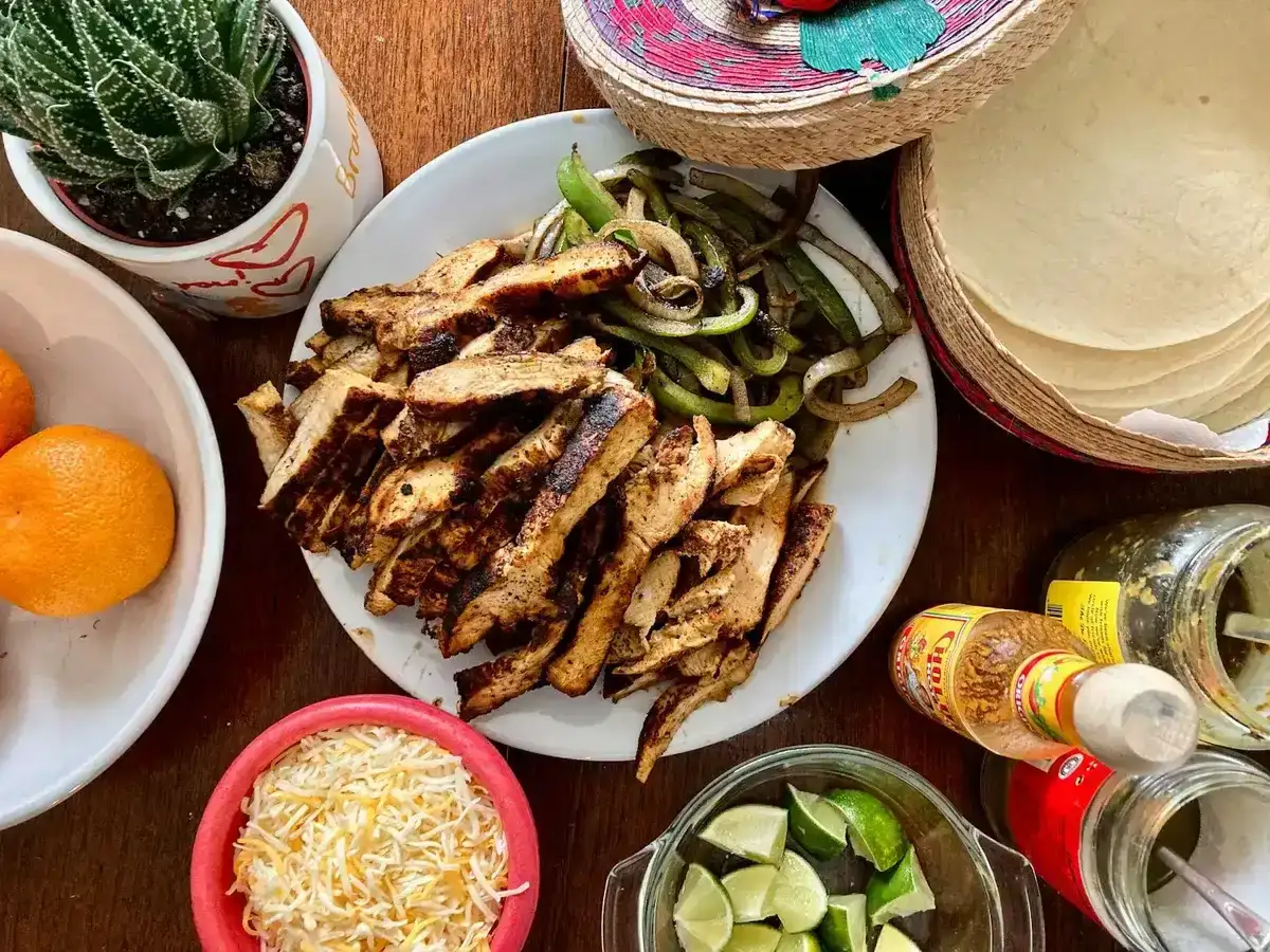 Chicken fajita meal spread with tortillas, cheese and limes in Baltimore
