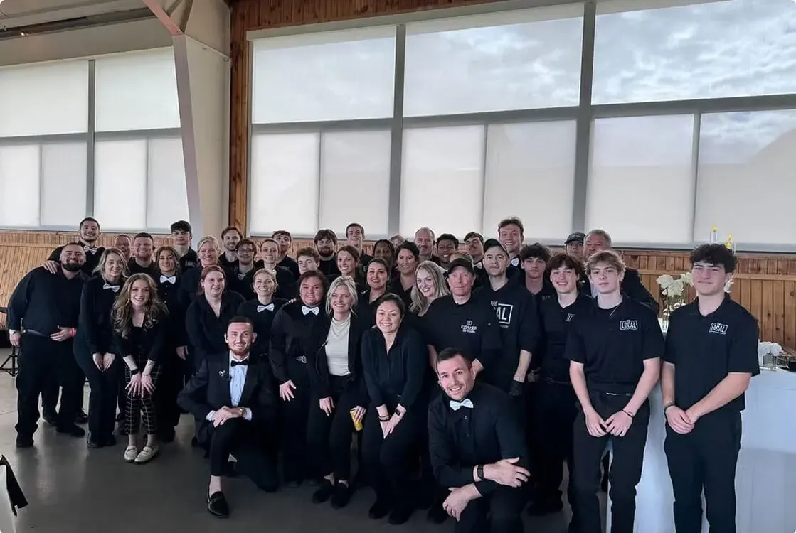 Evolved Catering event staff team gathered together before a catered event